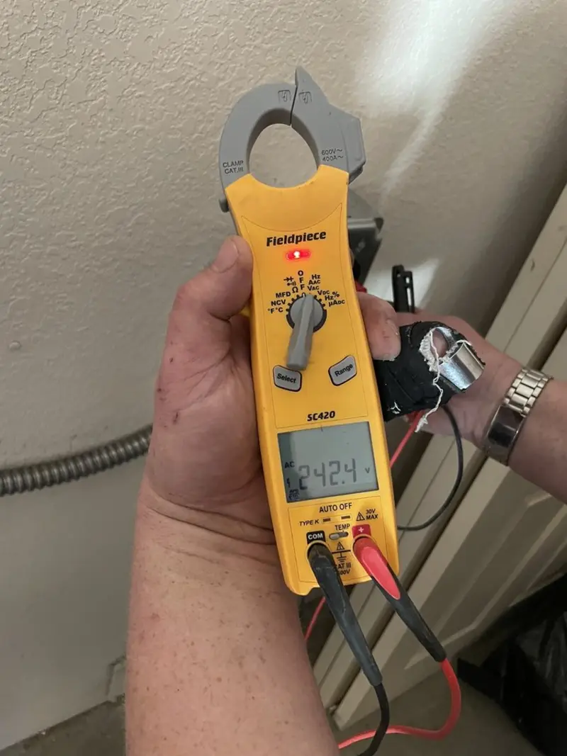 Voltage testing with clamp meter during Ceiling Fan Installation in Blooming Grove